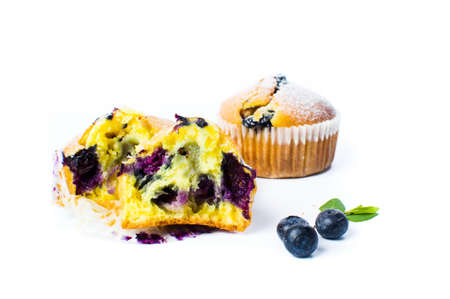Blueberry muffins in paper holders isolated on whiteの写真素材