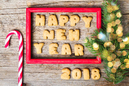 Happy new year note in a red wooden frameの写真素材