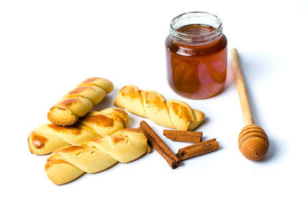 Cinnamon pastry with honey isolated on whiteの写真素材