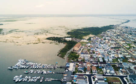 Docks and rooftops and sunset aerial photoの写真素材