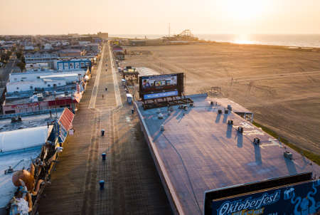 WILDWOOD, NEW JERSEY, USA - SEPTEMBER 5, 2017: Empty Wildwood boardwalk and beach at sunrise, shoot with a drone. Wildwood in a tourist resort city on the Atlantic coastのeditorial素材