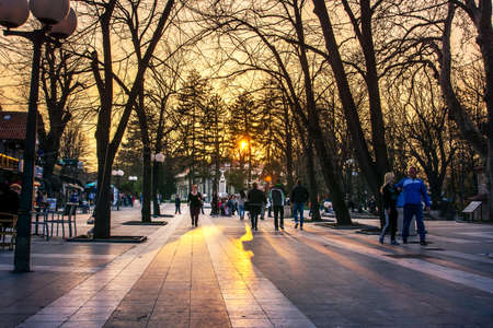 SOKOBANJA, SERBIA - March 25, 2017: Sokobanja, Serbia spa city with tourists and locals in the walking area at sunsetのeditorial素材