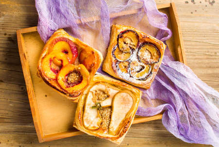 Baked fruit sweet pie slices on a trayの写真素材