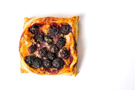 Homemade berry fruit pie slice on white backgroundの写真素材