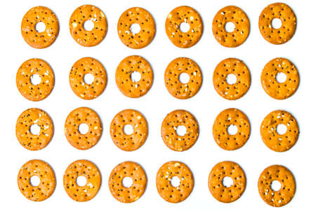 Round salty pretzels pattern isolated on white backgroundの写真素材
