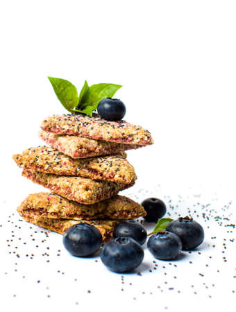 Triangle integral biscuits with blueberry fruit isolated