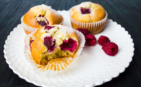 Home made raspberry muffins in paper holders