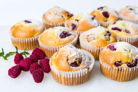 Home made raspberry muffins in paper holdersの写真素材