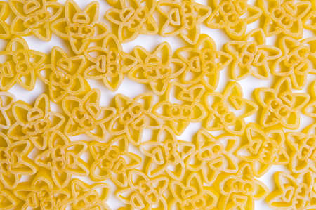 Golden raw pasta making a background patternの写真素材