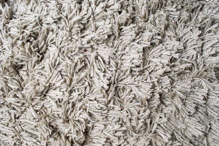 Fluffy gray carpet making a background pattern