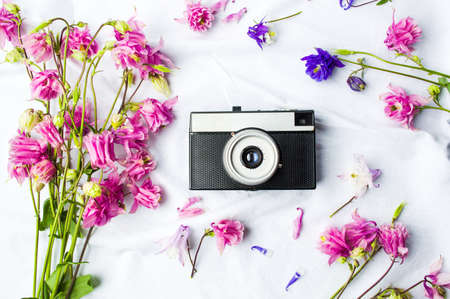 Vintage camera and colorful flowers flat layの写真素材