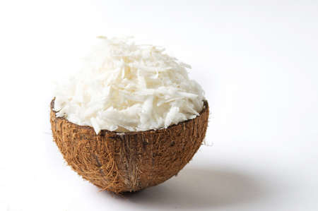 Grated coconut in a natural shell as bowlの写真素材