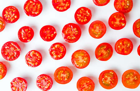 Sliced small cherry tomatoes background flat layの写真素材