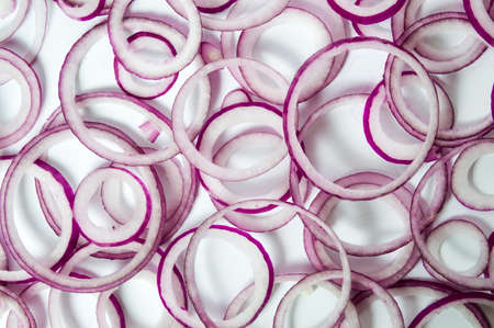 Purple onion raw slices on white backgroundの写真素材
