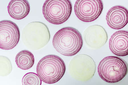 Purple onion raw slices on white backgroundの写真素材