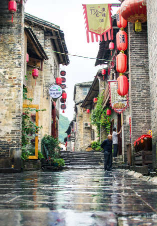 HUZHOU, CHINA - MAY 3, 2017: Huang Yao Ancient Town in Zhaoping county, Guangxi province. Traditional Chinese architecture and street decorationのeditorial素材