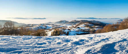 Winter landscape with snow covered mountain and clear skyの写真素材