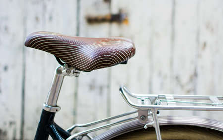 Vintage bicycle with leather seat close upの写真素材