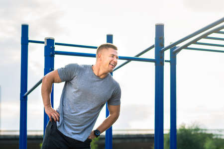 Man stretching before a street workout outdoors