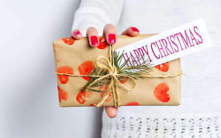 Girl holding a Christmas present box. Holiday seasonの写真素材