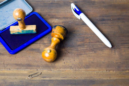 Old wooden stamp isolated on white backgroundの写真素材