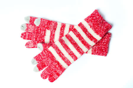Woven red touchscreen winter gloves isolated on whiteの写真素材