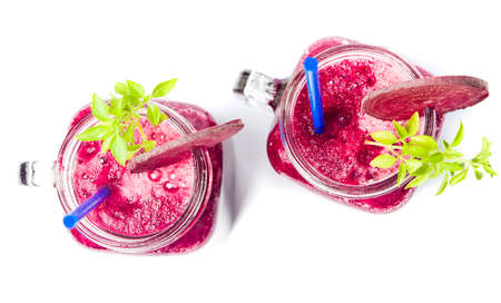 Healthy beet smoothie in a jar isolated on whiteの写真素材