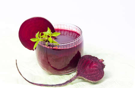 Healthy beet smoothie in a jar isolated on whiteの写真素材