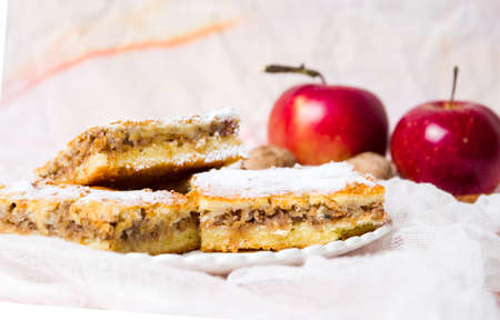 Homemade apple pie on a plate with fresh applesの写真素材