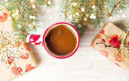 Cup of coffee with festive decorations on the tableの写真素材
