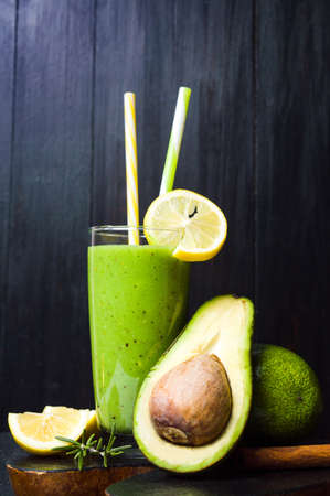 Avocado smoothie and fruits isolated on black backgroundの写真素材