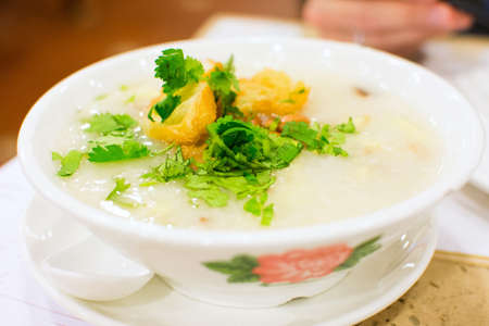 Chinese famous snack Tingzai Porridge served on the table in restuarantの写真素材