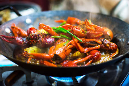 Tasty hot and spicy crayfish pot served on the table