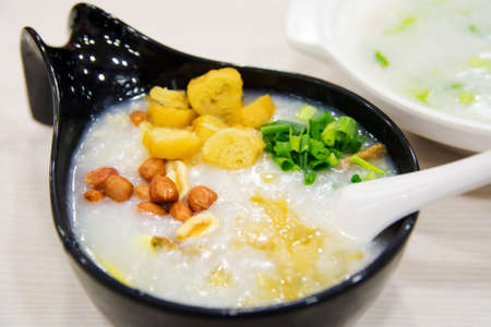 Chinese famous Tingzai rice porridge served in a restaurantの写真素材