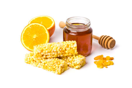 Jar of honey and orange, honey dessert isolated on white backgroundの写真素材