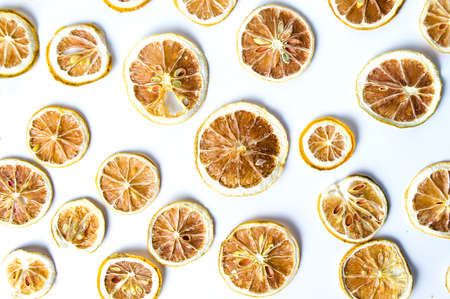 Dried sliced lemon background pattern isolated on whiteの写真素材