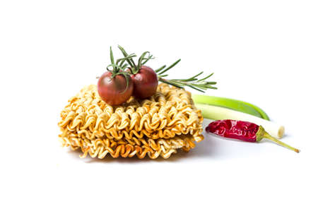 Uncooked pasta and tomato chili isolated on white backgroundの写真素材