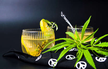 Cannabis tea with marijuana branch and lemonの写真素材