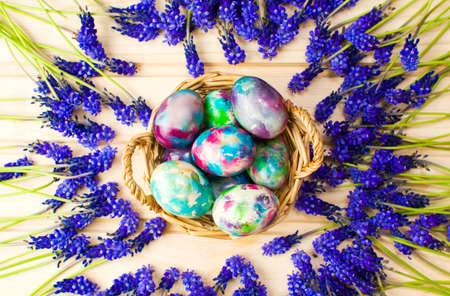 Hand painted Easter eggs and purple spring flowers
