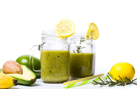 Avocado smoothie in a glass isolated on white backgroundの写真素材
