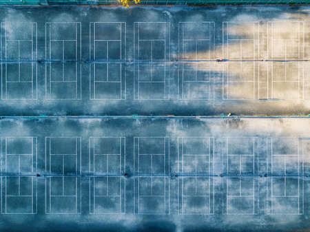 Aerial view of many concrete tennis courtsの写真素材