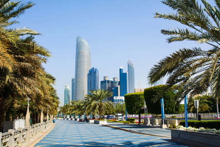 Abu Dhabi Corniche walking area with landmark view of modern buildings on Corniche road, UAEのeditorial素材