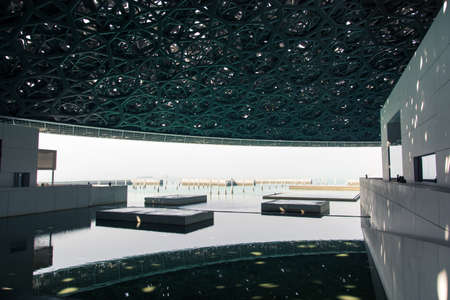 ABU DHABI, UNITED ARAB EMIRATES - JANUARY 26, 2018: Louvre Abu Dhabi modern hall with Rain of Light...
