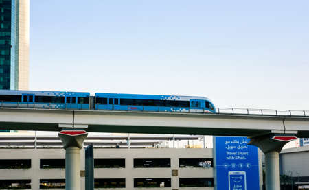 DUBAI, UNITED ARAB EMIRATES - FEBRUARY 5, 2018: Dubai metro train running on the elevated viaduct in...