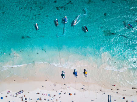 Boats at the beach in Tulum Mexico on a sunny day aerial viewの写真素材