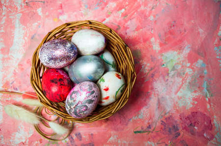 Painted Easter eggs on colorful red background top viewの写真素材