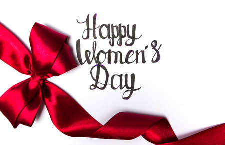 Happy Womens day card with red ribbon on whiteの写真素材