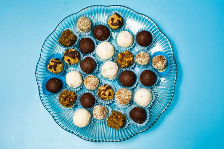 Homemade cookies in paper cups on blue background top viewの写真素材