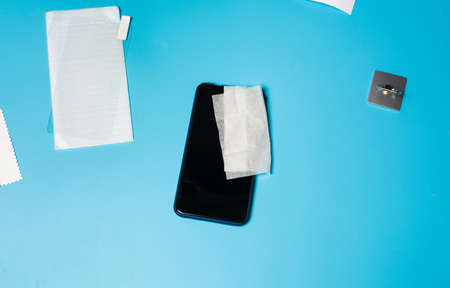 Phone screen protection and ring ready to be placedの写真素材