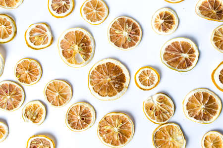 Dried sliced lemon background pattern isolated on whiteの写真素材